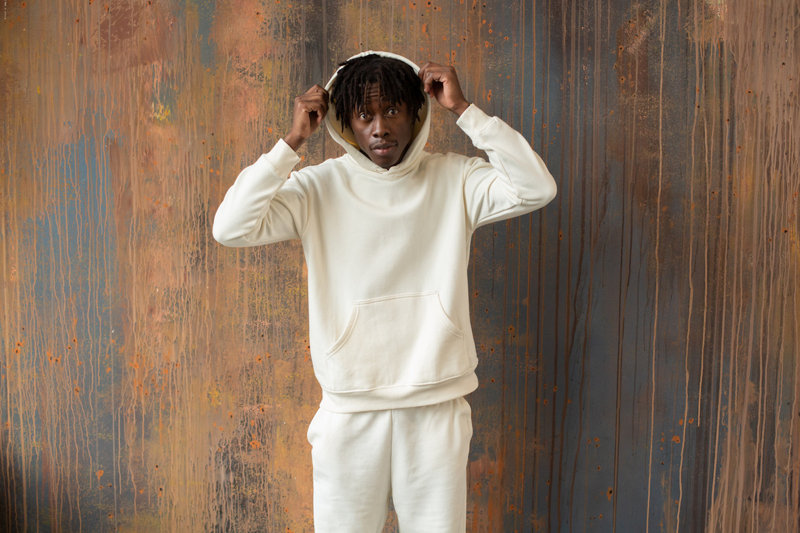 Stylish black man in white hoodie